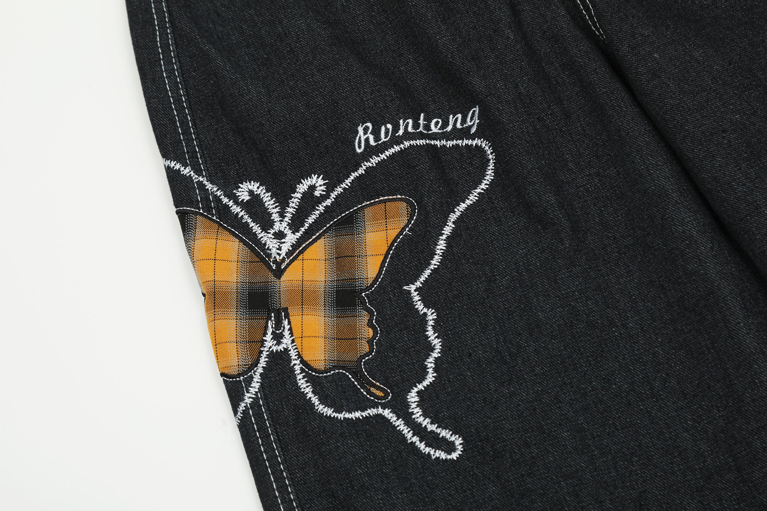 Broderie papillon | Jean en denim foncé