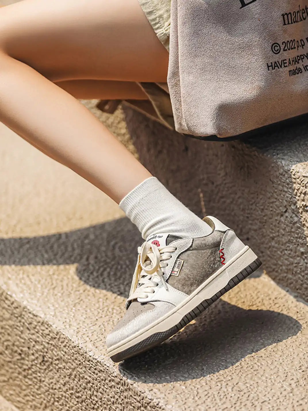 Worn Suede Panel Low Top Sneakers on foot styling image 1